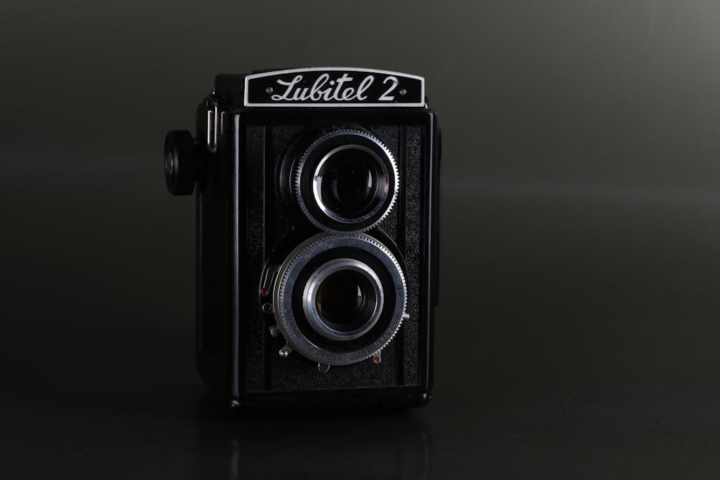 Classic Lubitel 2 twin lens reflex camera against a dark backdrop, ideal for photography enthusiasts.